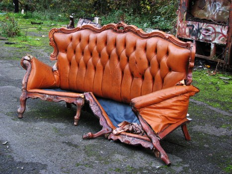 Skip hire site overview with safety signage