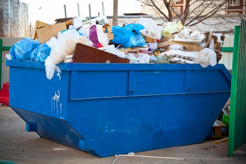 Recycling and skip hire trucks in Purley at a neighbourhood site