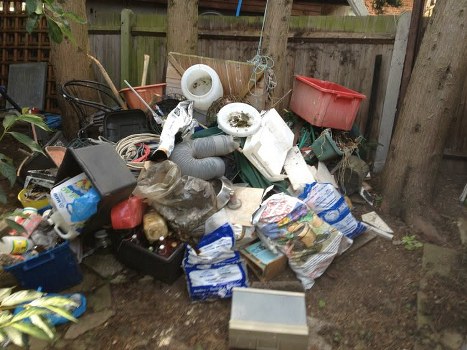 Customer loading a skip hired in Purley